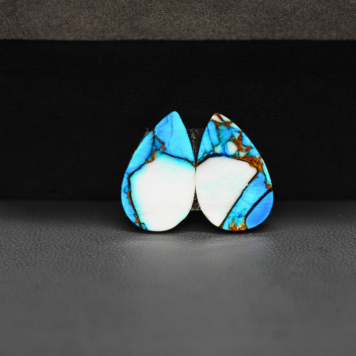 Kingman Ice Blue Dahlia Pear Cabochon Pair 18x11x3mm 11.5ct - icy blue and white stone with copper veining - Pedra Gems