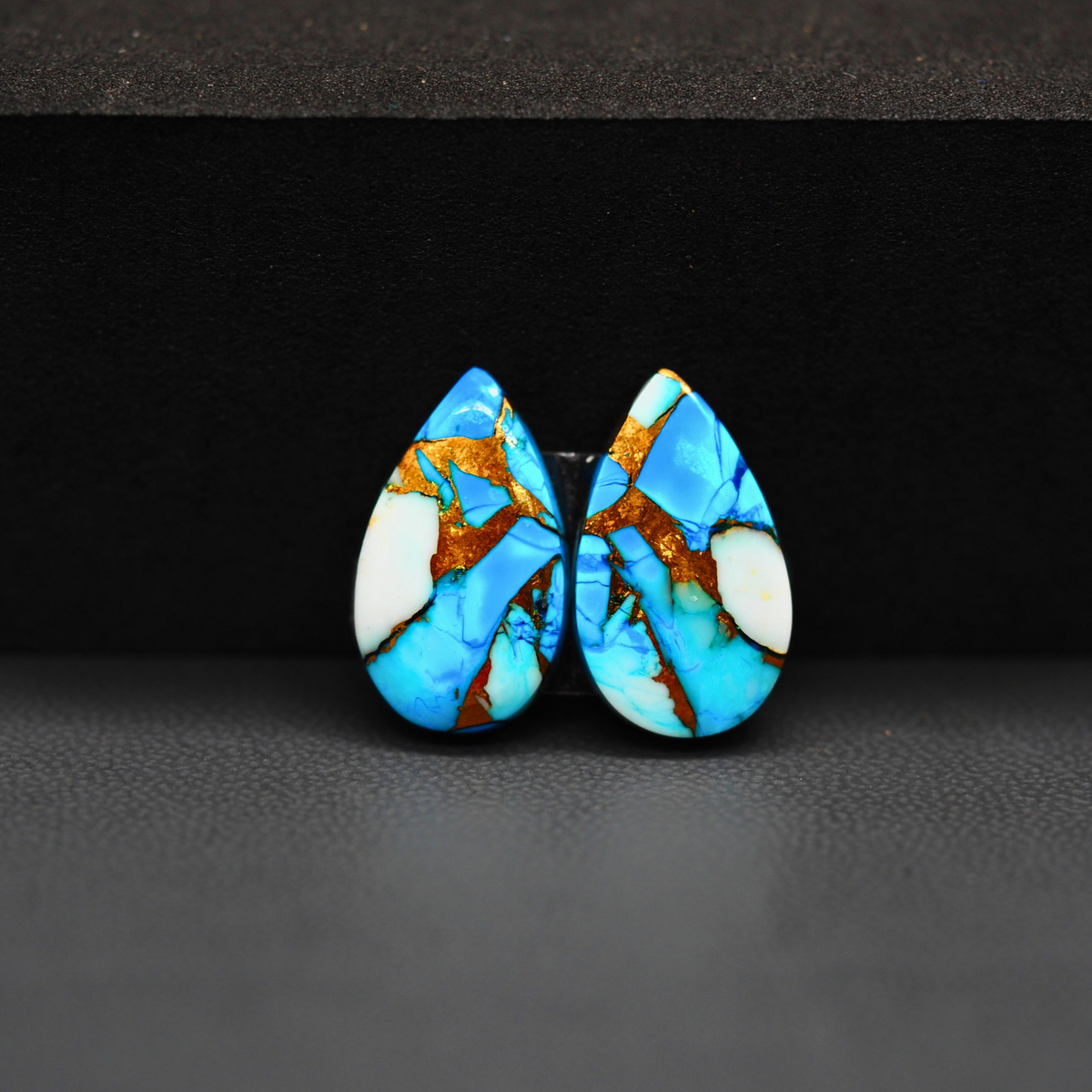Kingman Ice Blue Dahlia Composite Pear Cabochon Pair 18x11x3mm 11.5ct - icy blue and white stone with copper veining - Pedra Gems