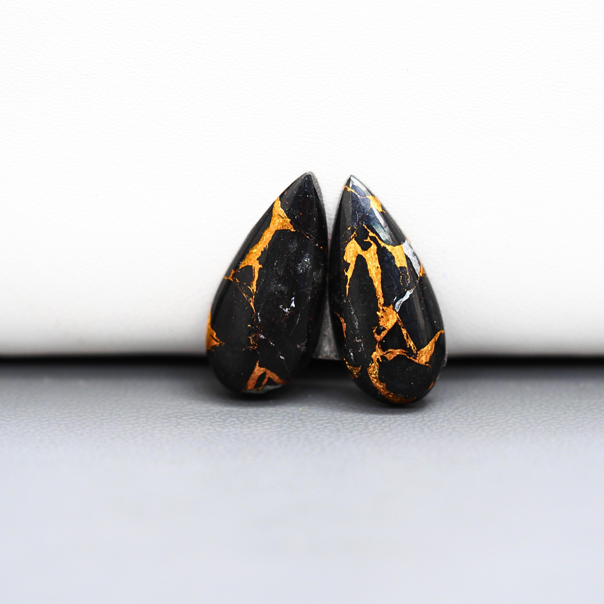 Kingman Black Buffalo Copper Composite Pear Cabochon Pair 21x8x4mm 12.5ct - black stone with bright copper veins - Pedra Gems