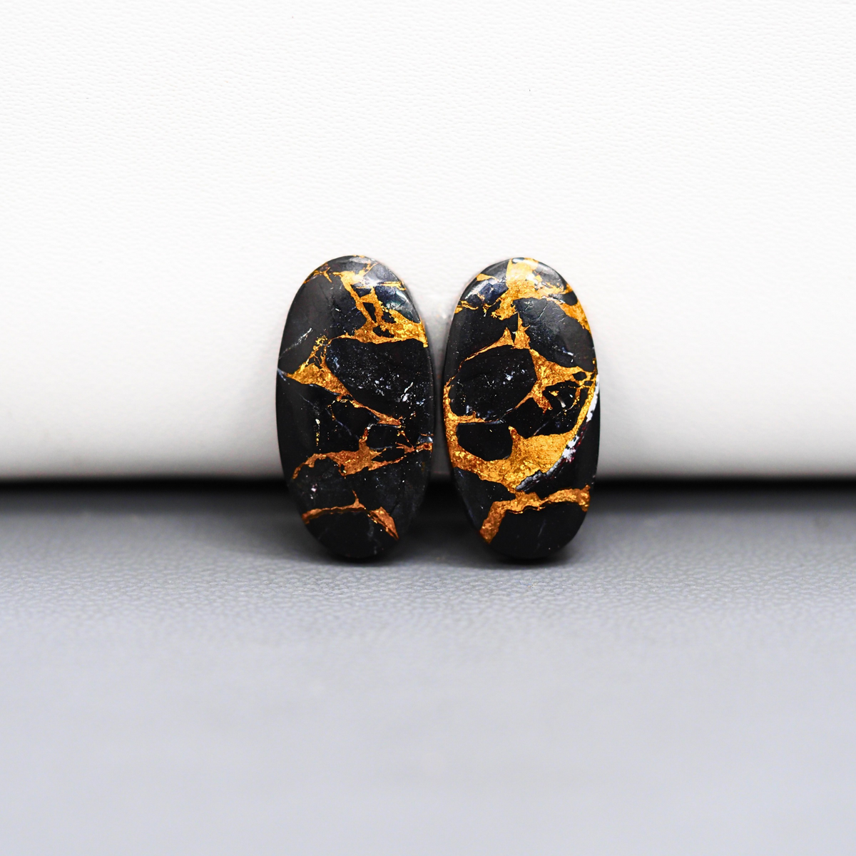 Kingman Black Buffalo Copper Composite Oval Cabochon Pair 19x10x3mm 13.5ct - black stone with bright copper veins - Pedra Gems