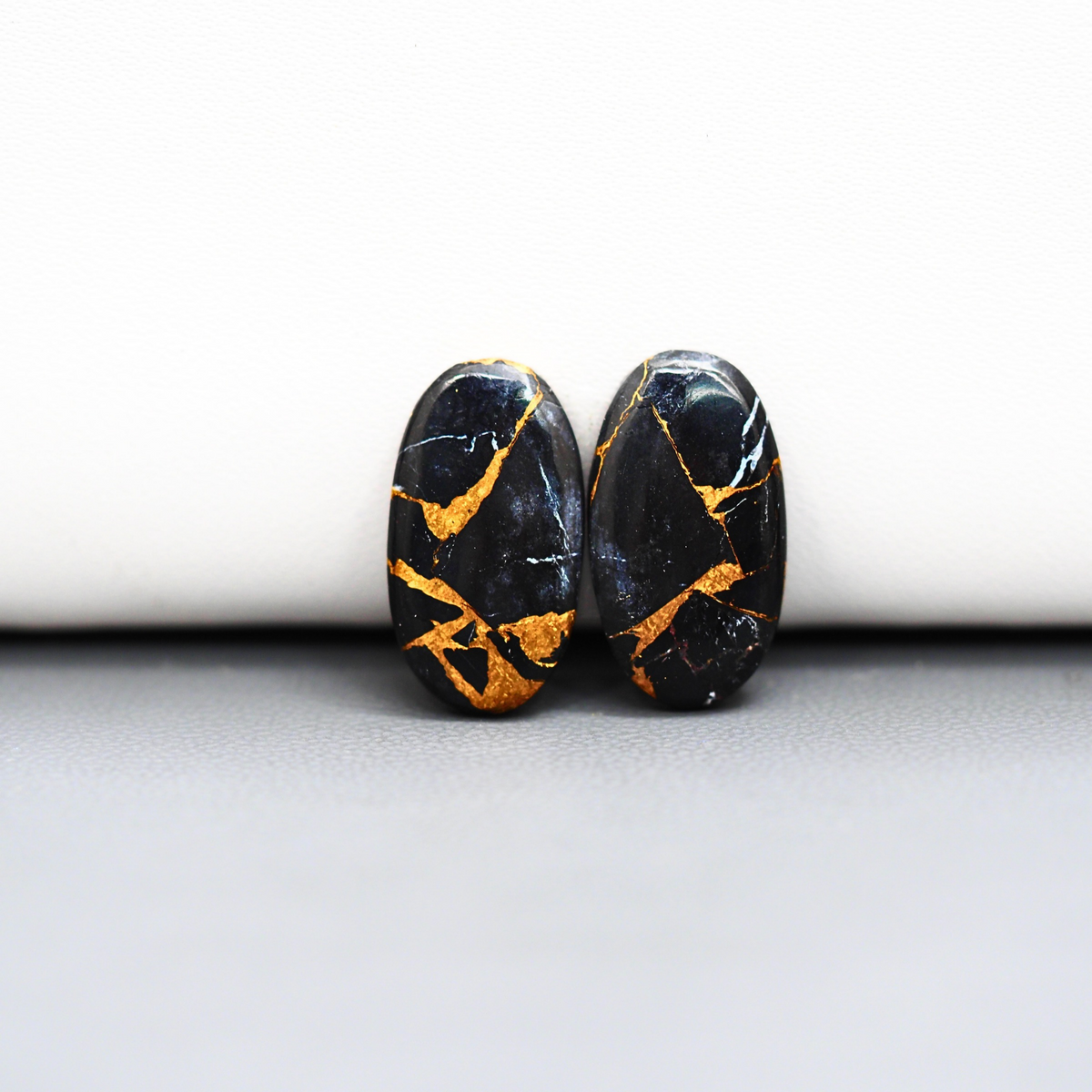 Kingman Black Buffalo Copper Composite Oval Cabochon Pair 19x10x3mm 12ct - black stone with bright copper veins - Pedra Gems