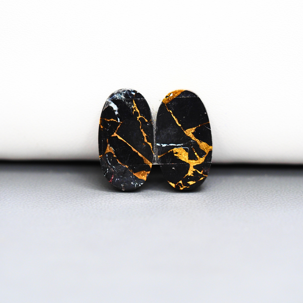 Kingman Black Buffalo Copper Composite Oval Cabochon Pair 19x10x3mm 12ct - black stone with bright copper veins - Pedra Gems