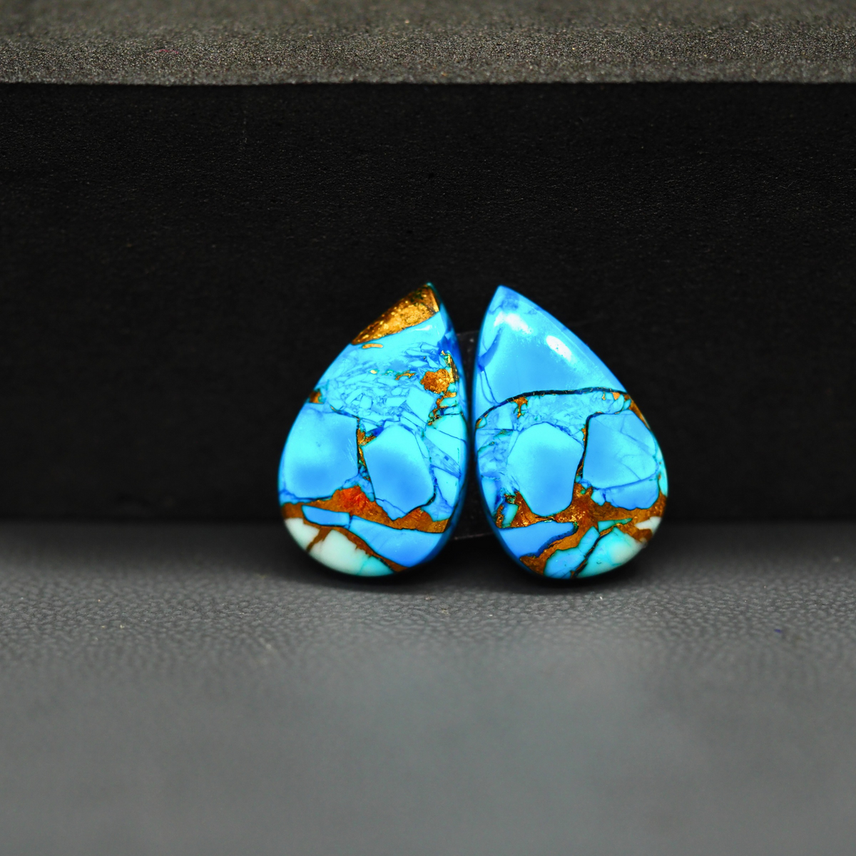 Kingman Ice Blue Dahlia Pear Cabochon Pair 17x11x3mm 10.5ct - icy blue and white stone with copper veining - Pedra Gems