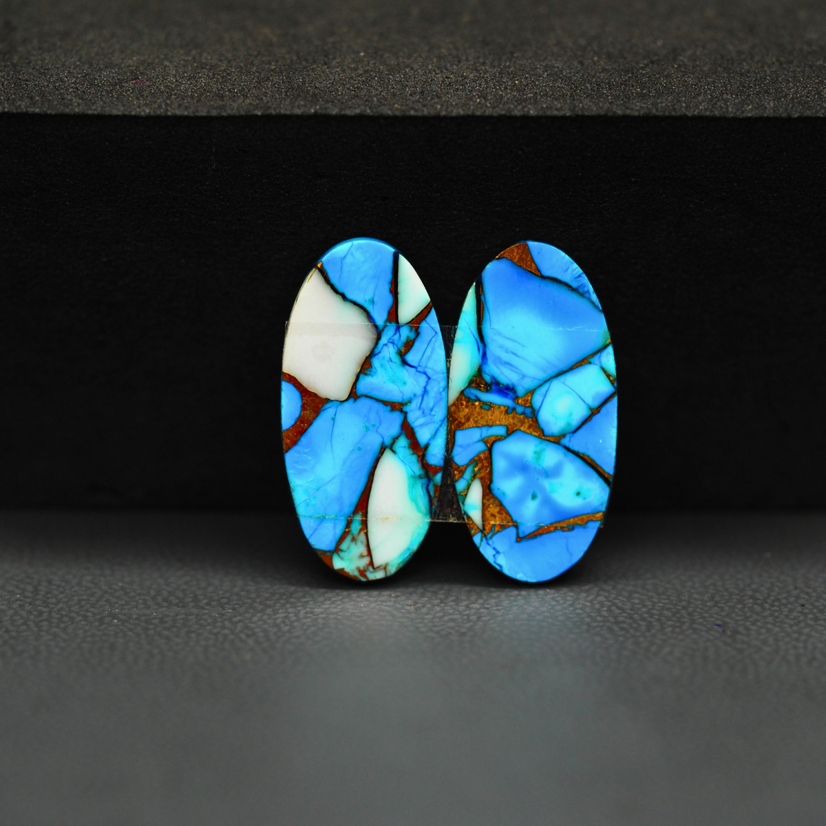 Kingman Ice Blue Dahlia Oval Cabochon Pair 21x11x3mm 15.5ct - icy blue and white stone with copper veining - Pedra Gems