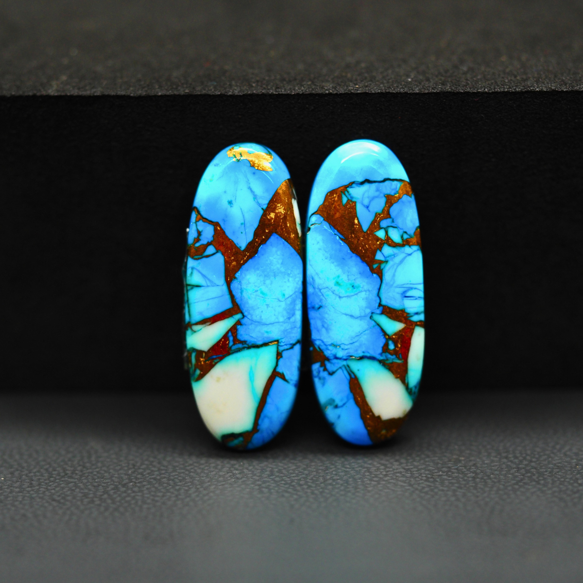 Kingman Ice Blue Dahlia Composite Oval Cabochon Pair 27x10x3mm 18.5ct - icy blue and white stone with copper veining - Pedra Gems