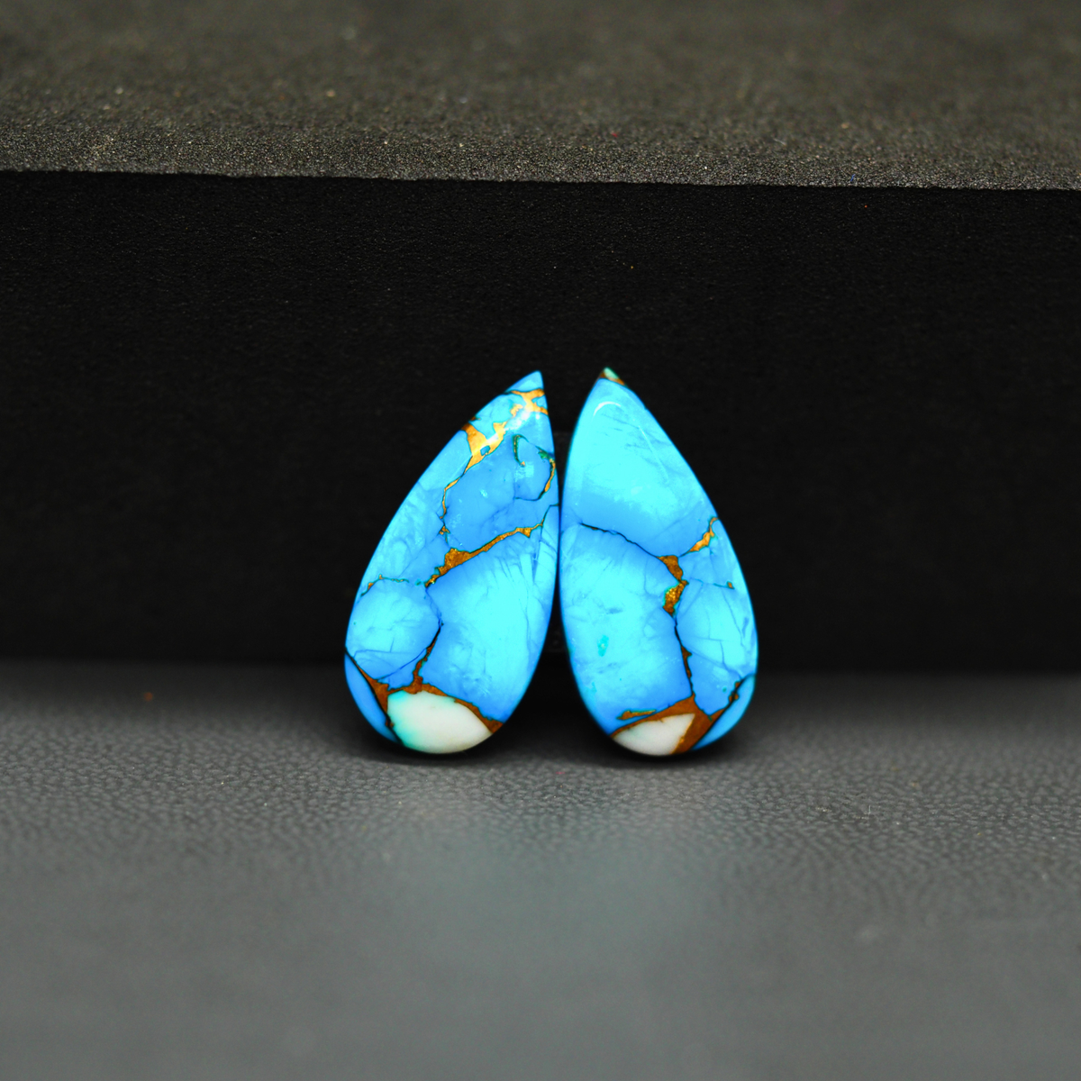 Kingman Ice Blue Dahlia Composite Pear Cabochon Pair 20x10x3mm 12ct - icy blue and white stone with copper veining - Pedra Gems