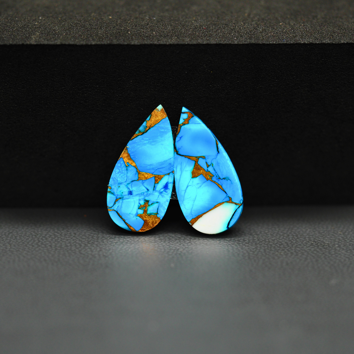 Kingman Ice Blue Dahlia Composite Pear Cabochon Pair 20x10x3mm 12ct - icy blue and white stone with copper veining - Pedra Gems