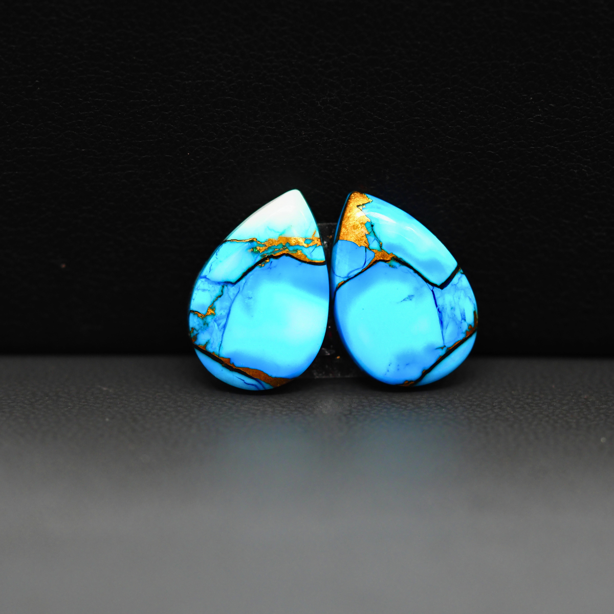 Kingman Ice Blue Dahlia Composite Pear Cabochon Pair 15x11x3mm 11ct - icy blue and white stone with copper veining - Pedra Gems