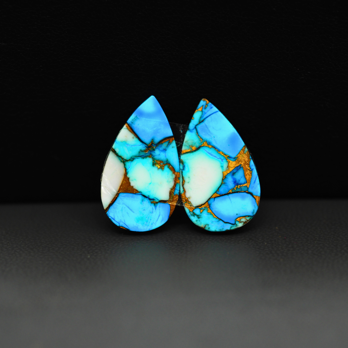 Kingman Ice Blue Dahlia Composite Pear Cabochon Pair 21x12x3mm 14ct - icy blue and white stone with copper veining - Pedra Gems