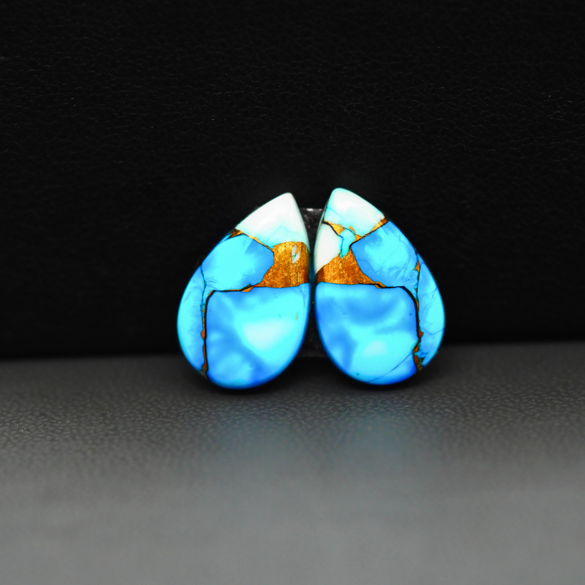 Kingman Ice Blue Dahlia Composite Pear Cabochon Pair 17x11x3mm 10.5ct - icy blue and white stone with copper veining - Pedra Gems