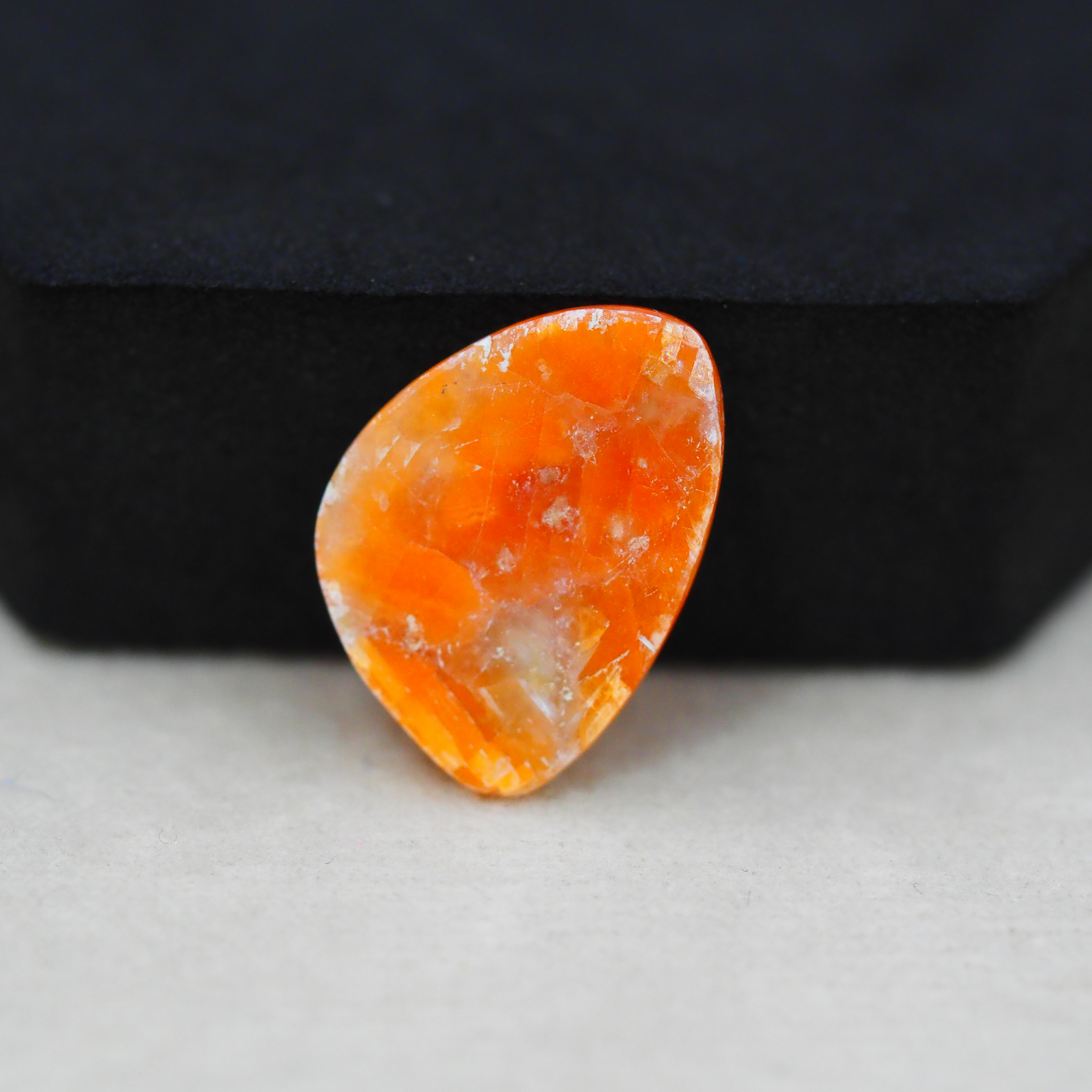 Natural Orange Calcite Trillion Cabochon 23x17mm 14ct - warm honey-orange - Pedra Gems.