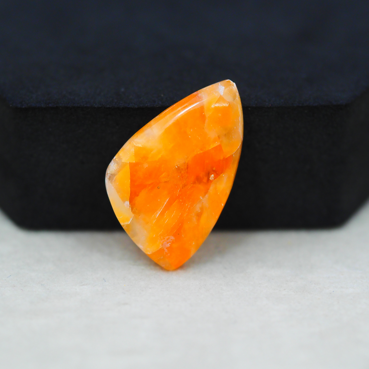 Natural Orange Calcite Trillion Cabochon 27x17mm 15.5ct - warm honey-orange - Pedra Gems.
