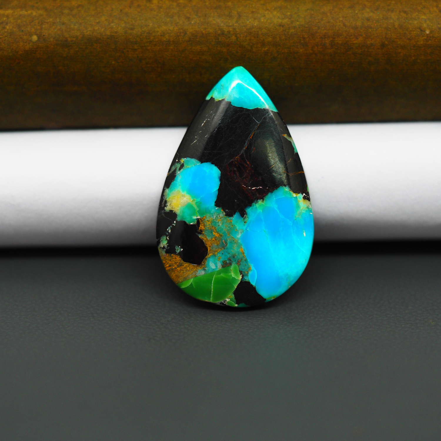 Mohave Turquoise & White Buffalo Pear Cabochon 31x20mm 18ct - Black with Bright Blue and Green - Pedra Gems