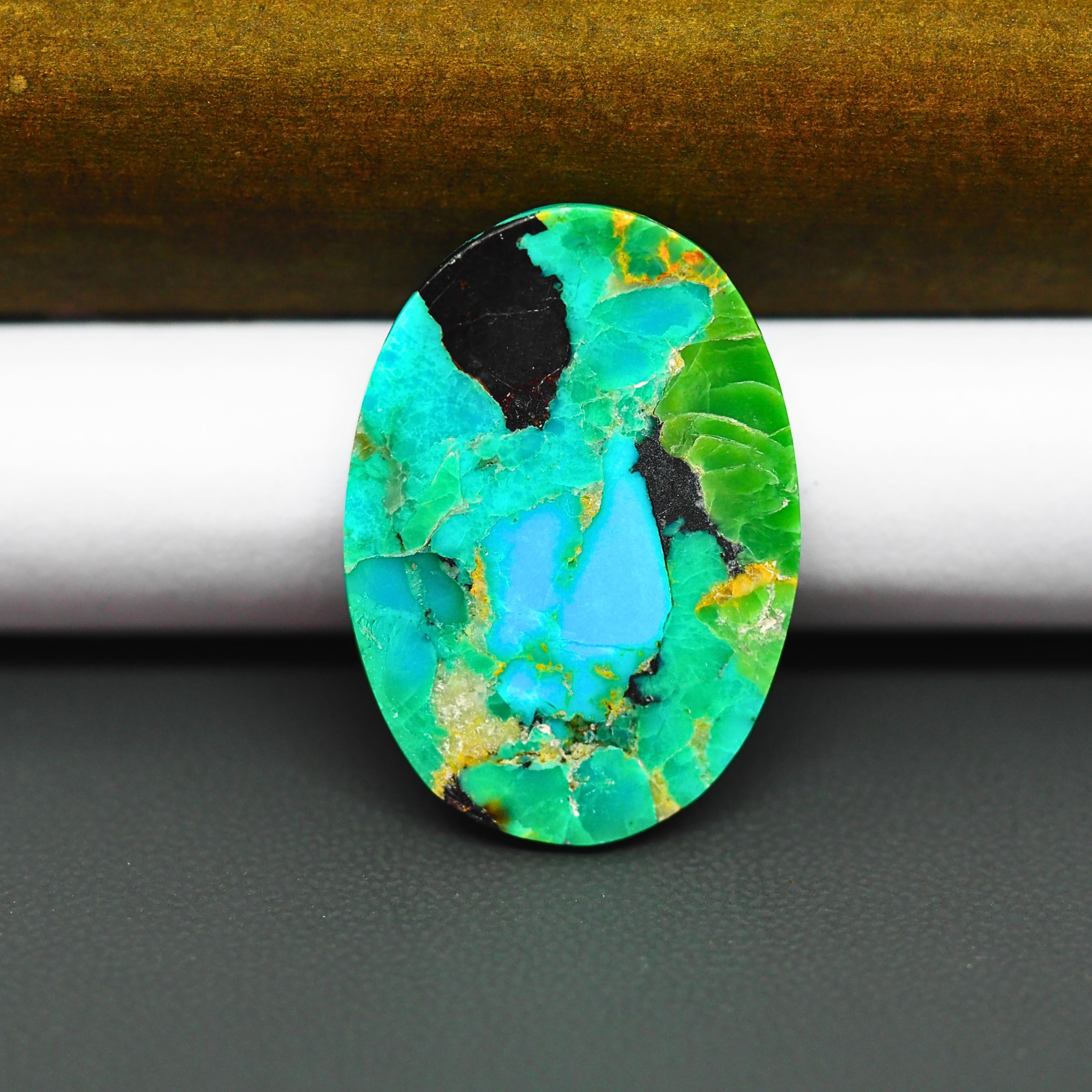Mohave Turquoise & White Buffalo Oval Cabochon 29x21mm 18ct - Green and Blue with Black Fragments - Pedra Gems