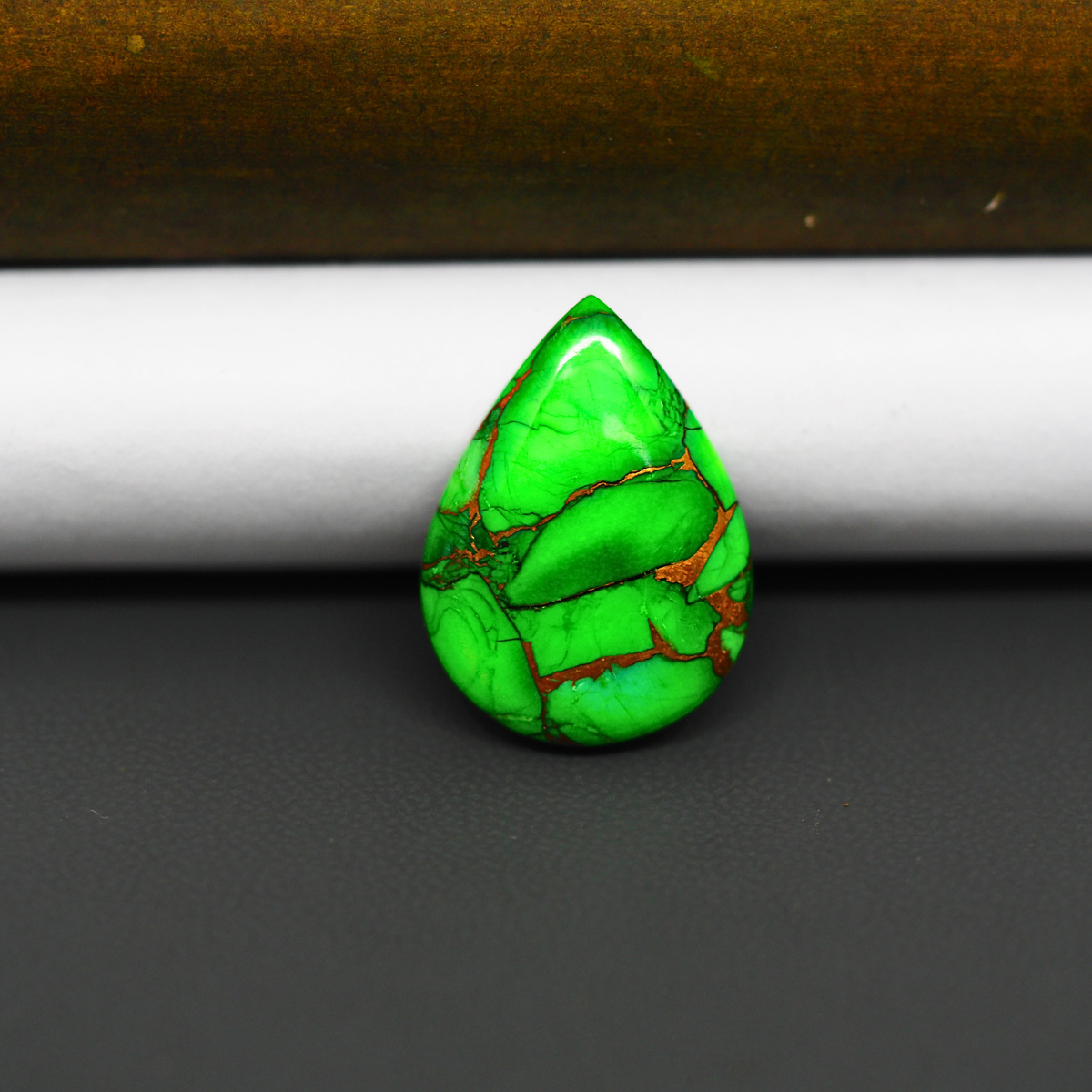 Natural Emerald Dahlia Pear Cabochon 21x15mm 12.5ct - vivid green with copper matrix, ships to Europe, Japan, Canada, Australia, NZ & worldwide - Pedra Gems.