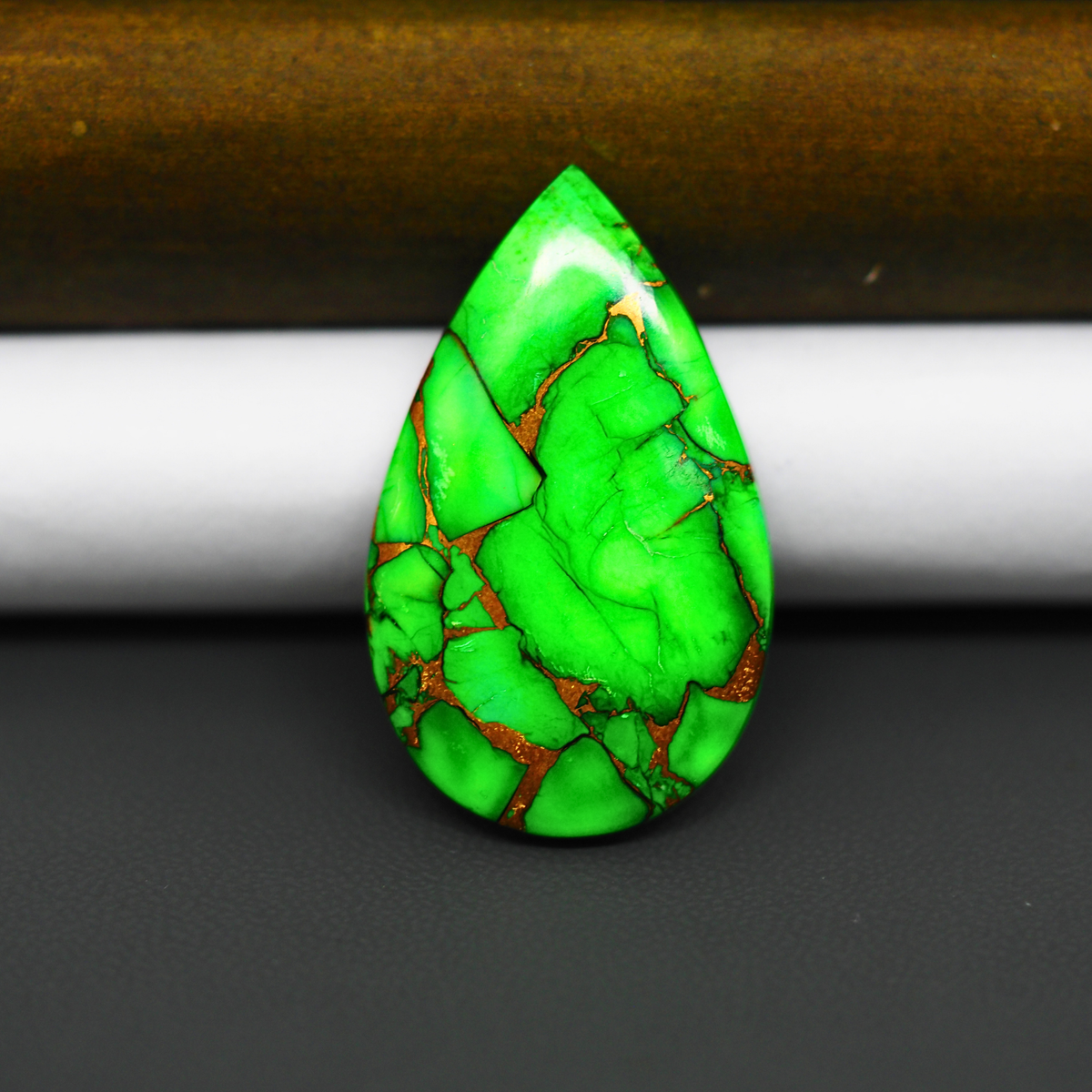 Natural Emerald Dahlia Pear Cabochon 35x21mm 22.5ct - vivid green with copper matrix, ships to Europe, Japan, Canada, Australia, NZ & worldwide - Pedra Gems.