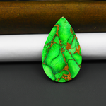 Natural Emerald Dahlia Pear Cabochon 35x21mm 22.5ct - vivid green with copper matrix, ships to Europe, Japan, Canada, Australia, NZ & worldwide - Pedra Gems.
