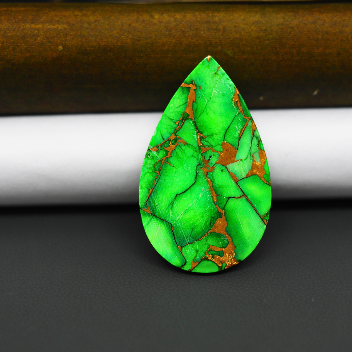 Natural Emerald Dahlia Pear Cabochon 35x21mm 22.5ct - vivid green with copper matrix, ships to Europe, Japan, Canada, Australia, NZ & worldwide - Pedra Gems.