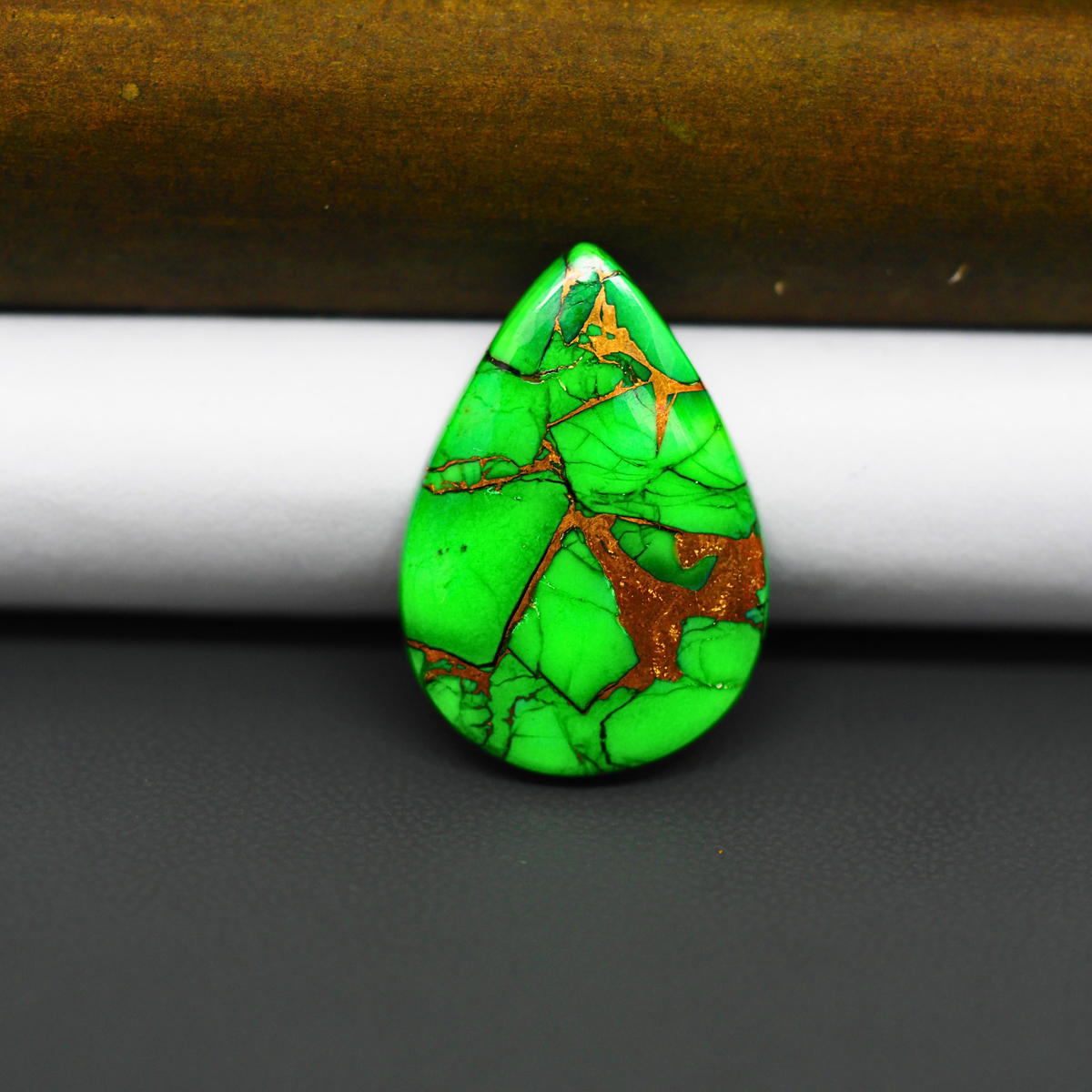 Natural Emerald Dahlia Pear Cabochon 26x18mm 14.5ct - vivid green with copper matrix, ships to Europe, Japan, Canada, Australia, NZ & worldwide - Pedra Gems.