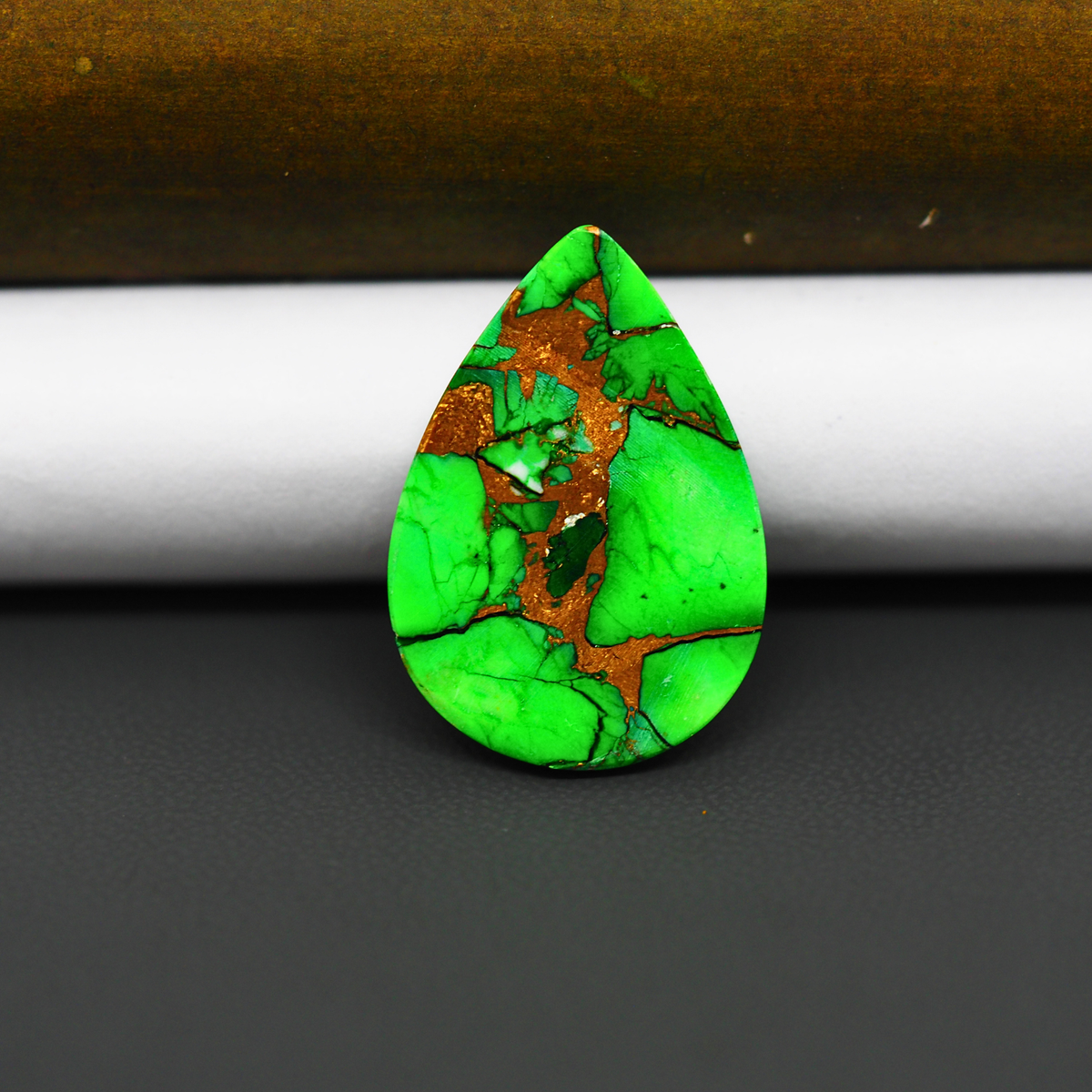 Natural Emerald Dahlia Pear Cabochon 26x18mm 14.5ct - vivid green with copper matrix, ships to Europe, Japan, Canada, Australia, NZ & worldwide - Pedra Gems.