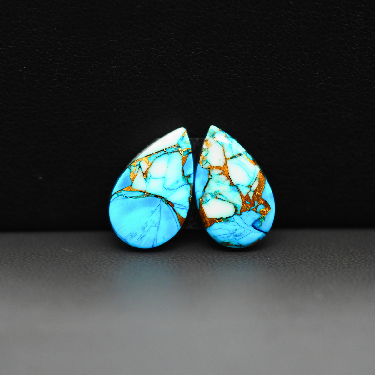 Kingman Ice Blue Dahlia Composite Pear Cabochon Pair 17x10x3mm 11ct - icy blue and white stone with copper veining - Pedra Gems