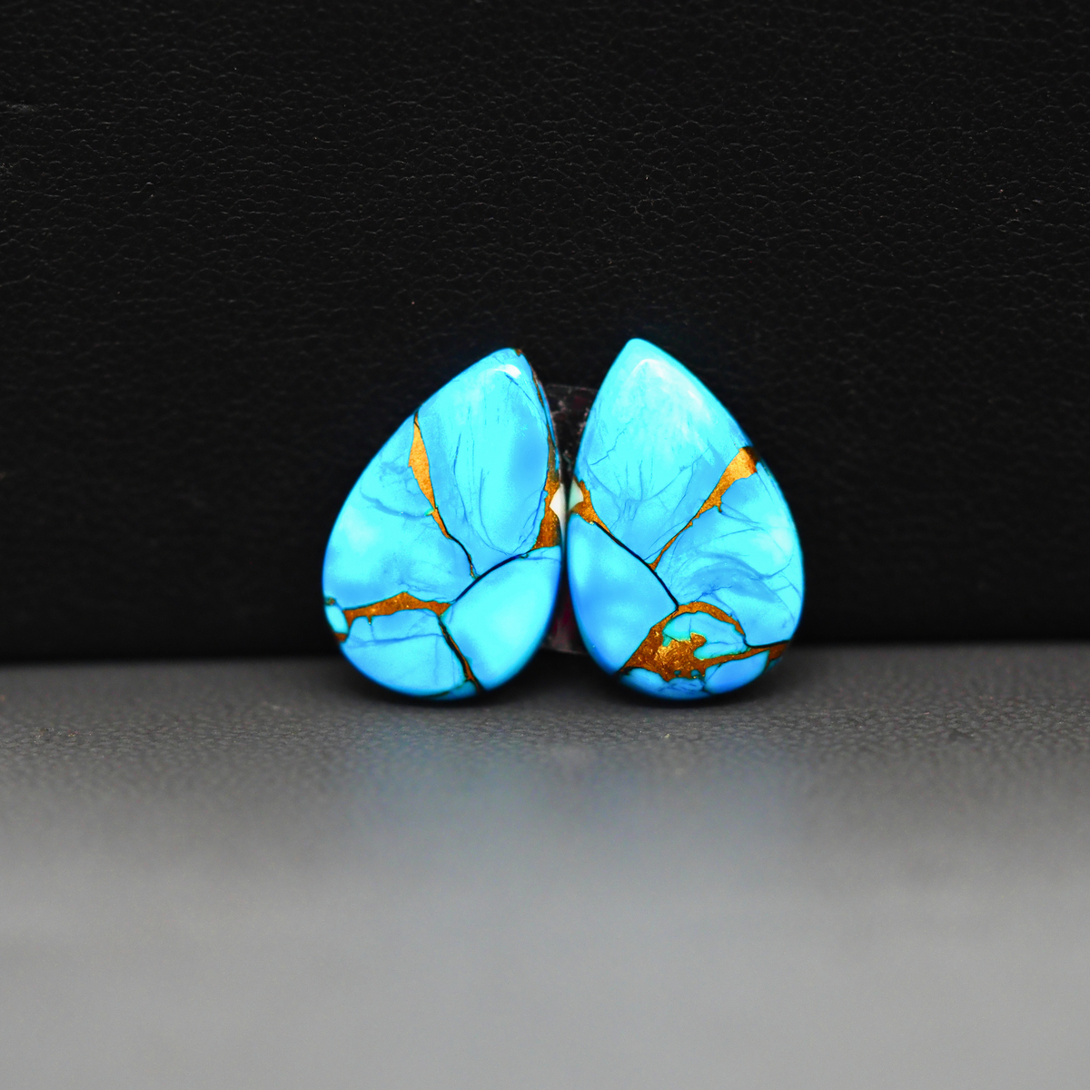 Kingman Ice Blue Dahlia Composite Pear Cabochon Pair 17x11x3mm 10ct - icy blue and white stone with copper veining - Pedra Gems