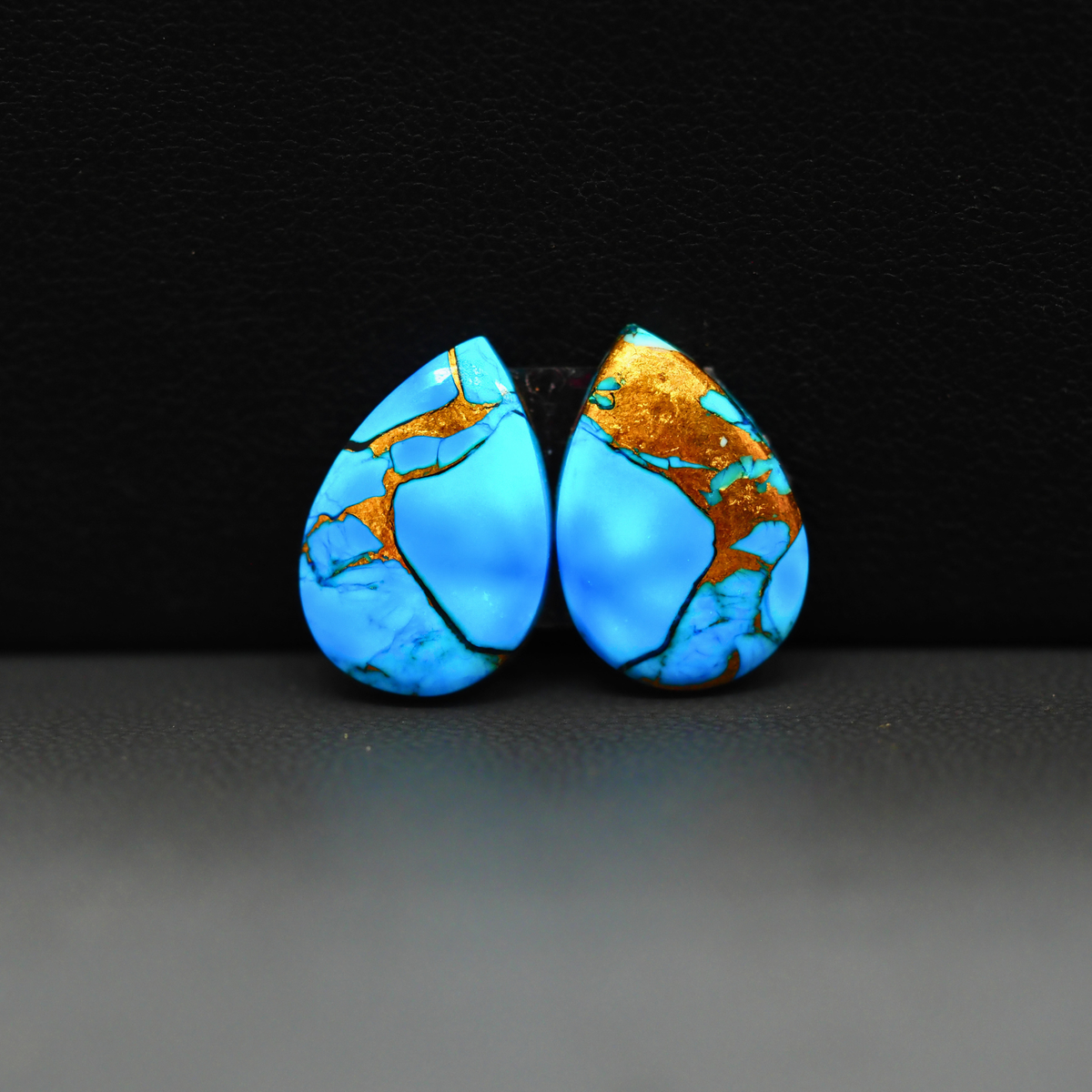 Kingman Ice Blue Dahlia Composite Pear Cabochon Pair 17x11x3mm 12ct - icy blue and white stone with copper veining - Pedra Gems