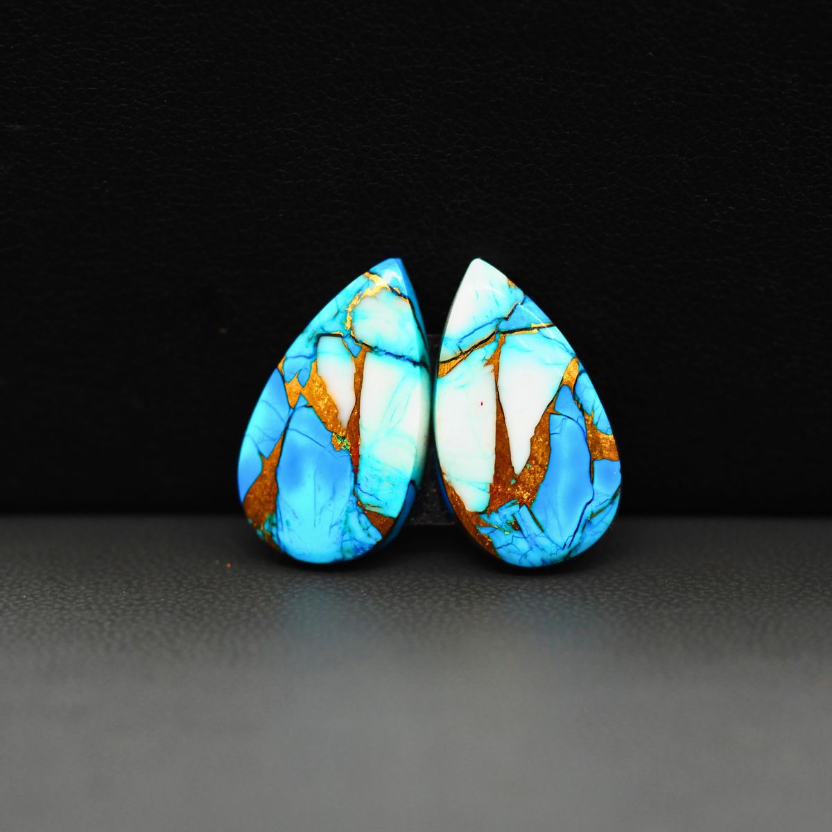 Kingman Ice Blue Dahlia Composite Pear Cabochon Pair 21x12x3mm 15.5ct - icy blue and white stone with copper veining - Pedra Gems