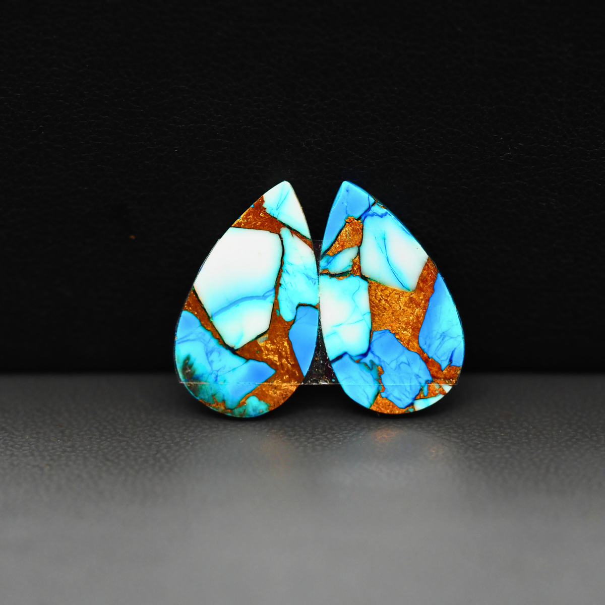 Kingman Ice Blue Dahlia Composite Pear Cabochon Pair 21x12x3mm 15.5ct - icy blue and white stone with copper veining - Pedra Gems