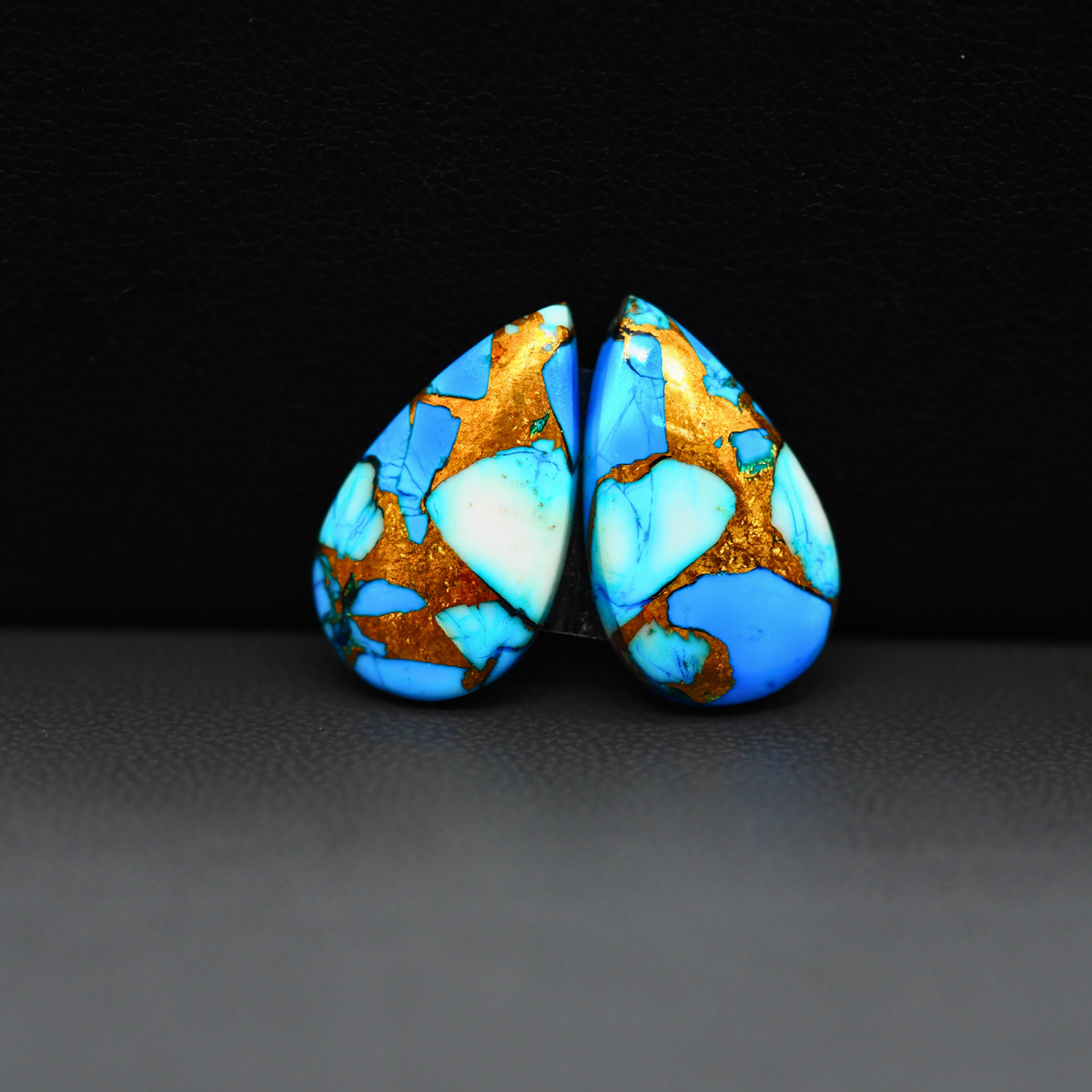 Kingman Ice Blue Dahlia Composite Pear Cabochon Pair 19x11x3mm 12ct - icy blue and white stone with copper veining - Pedra Gems