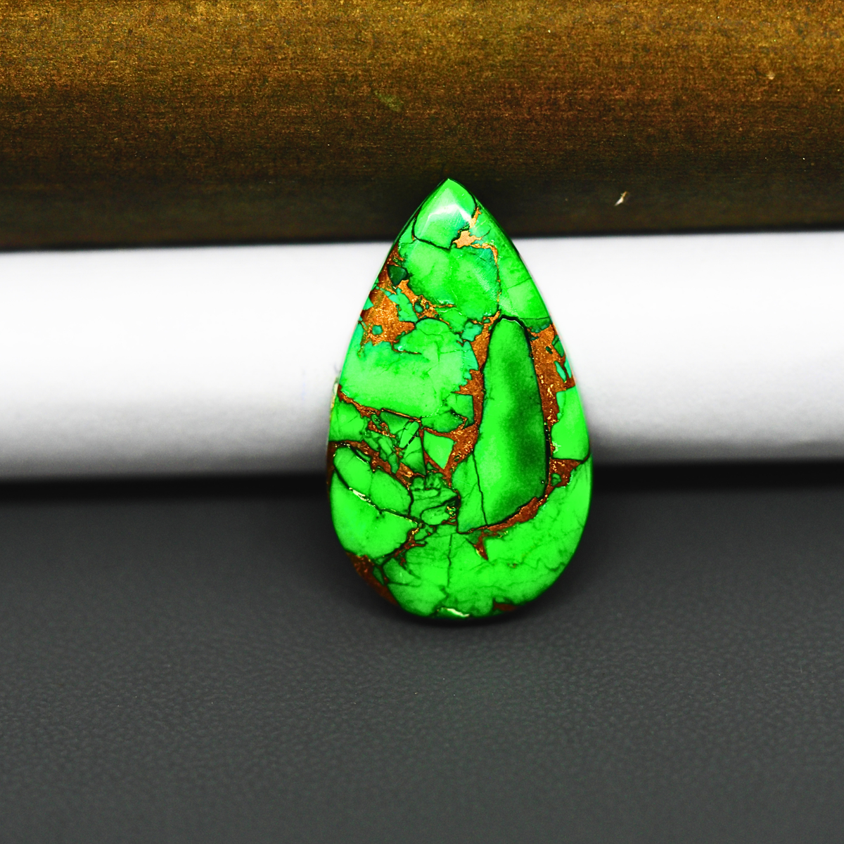 Natural Emerald Dahlia Pear Cabochon 27x16mm 16ct - vivid green with copper matrix, ships to Europe, Japan, Canada, Australia, NZ & worldwide - Pedra Gems.