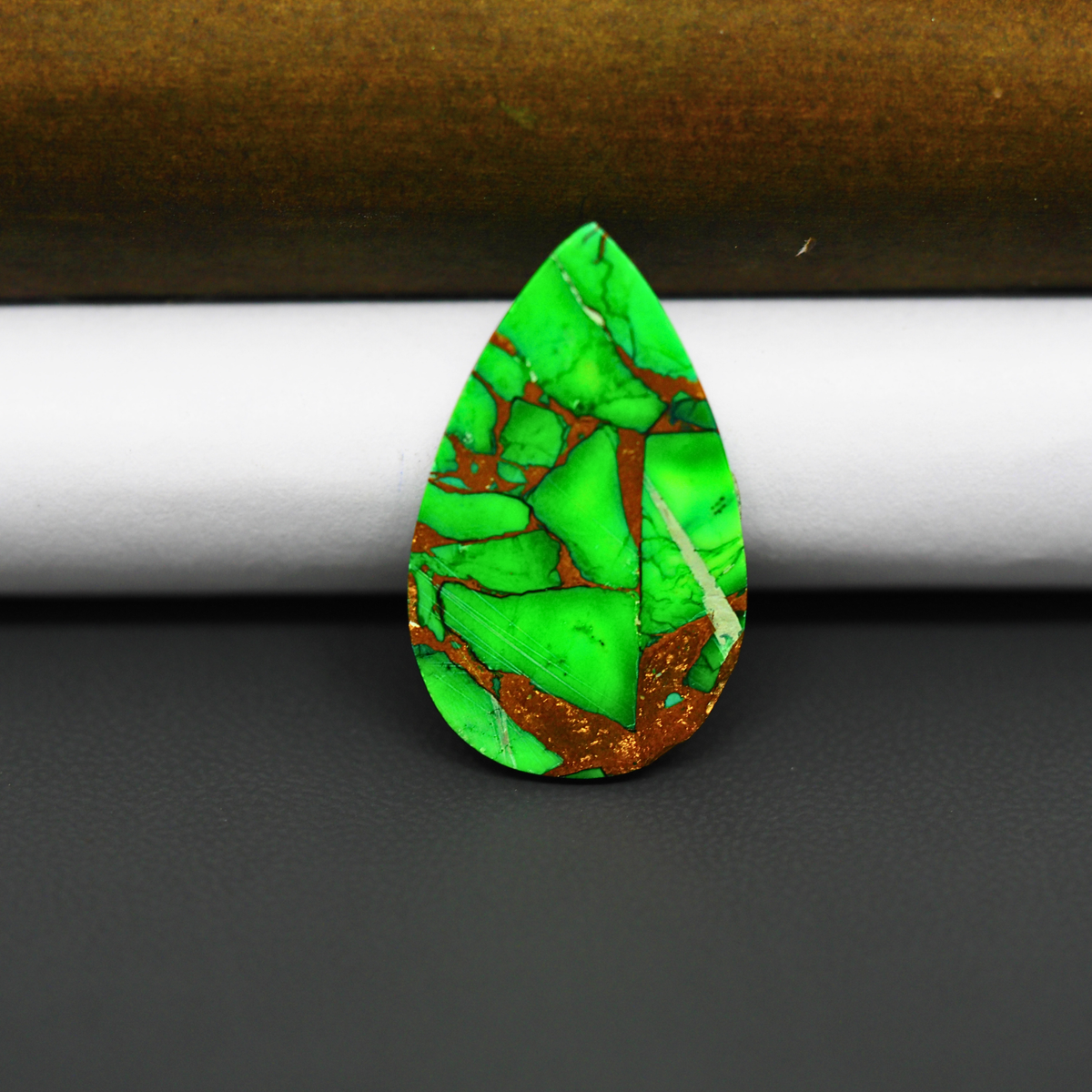 Natural Emerald Dahlia Pear Cabochon 27x16mm 16ct - vivid green with copper matrix, ships to Europe, Japan, Canada, Australia, NZ & worldwide - Pedra Gems.