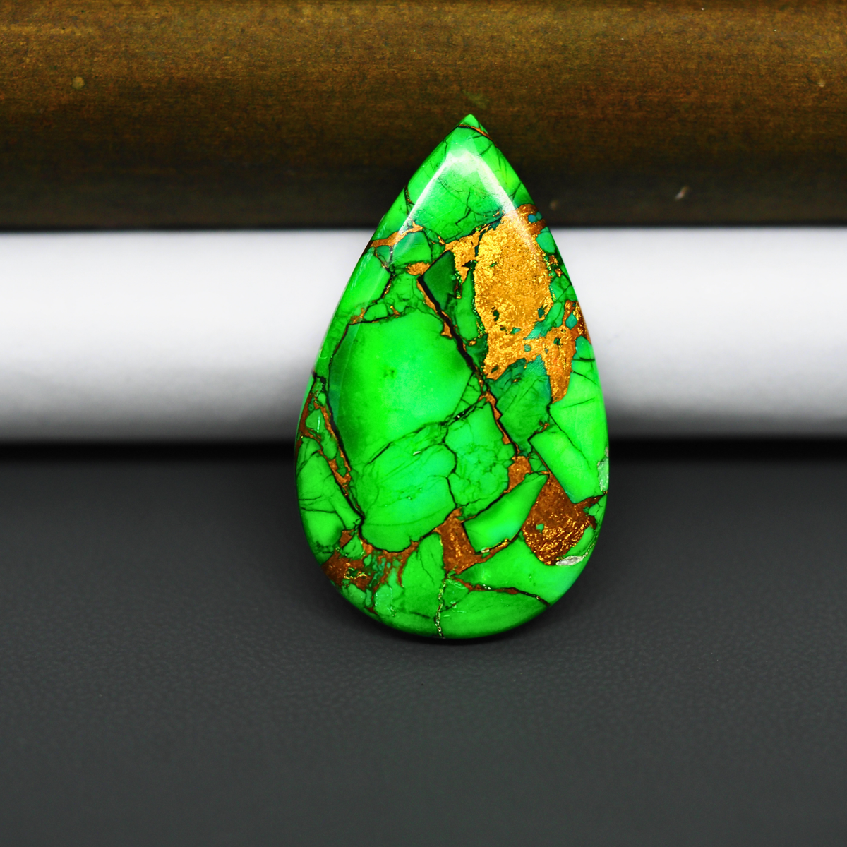 Natural Emerald Dahlia Pear Cabochon 35x21mm 23.5ct - vivid green with copper matrix, ships to Europe, Japan, Canada, Australia, NZ & worldwide - Pedra Gems.