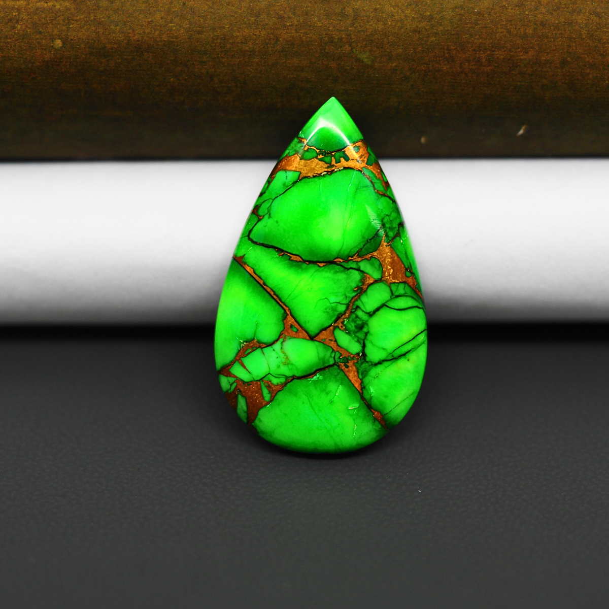 Natural Emerald Dahlia Pear Cabochon 31x17mm 21ct - vivid green with copper matrix, ships to Europe, Japan, Canada, Australia, NZ & worldwide - Pedra Gems.