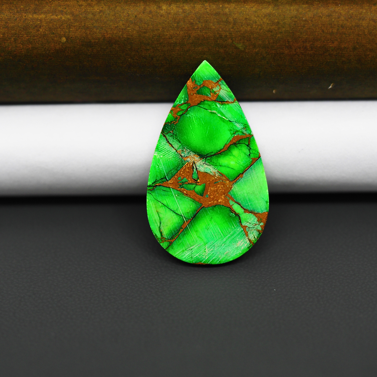 Natural Emerald Dahlia Pear Cabochon 31x17mm 21ct - vivid green with copper matrix, ships to Europe, Japan, Canada, Australia, NZ & worldwide - Pedra Gems.