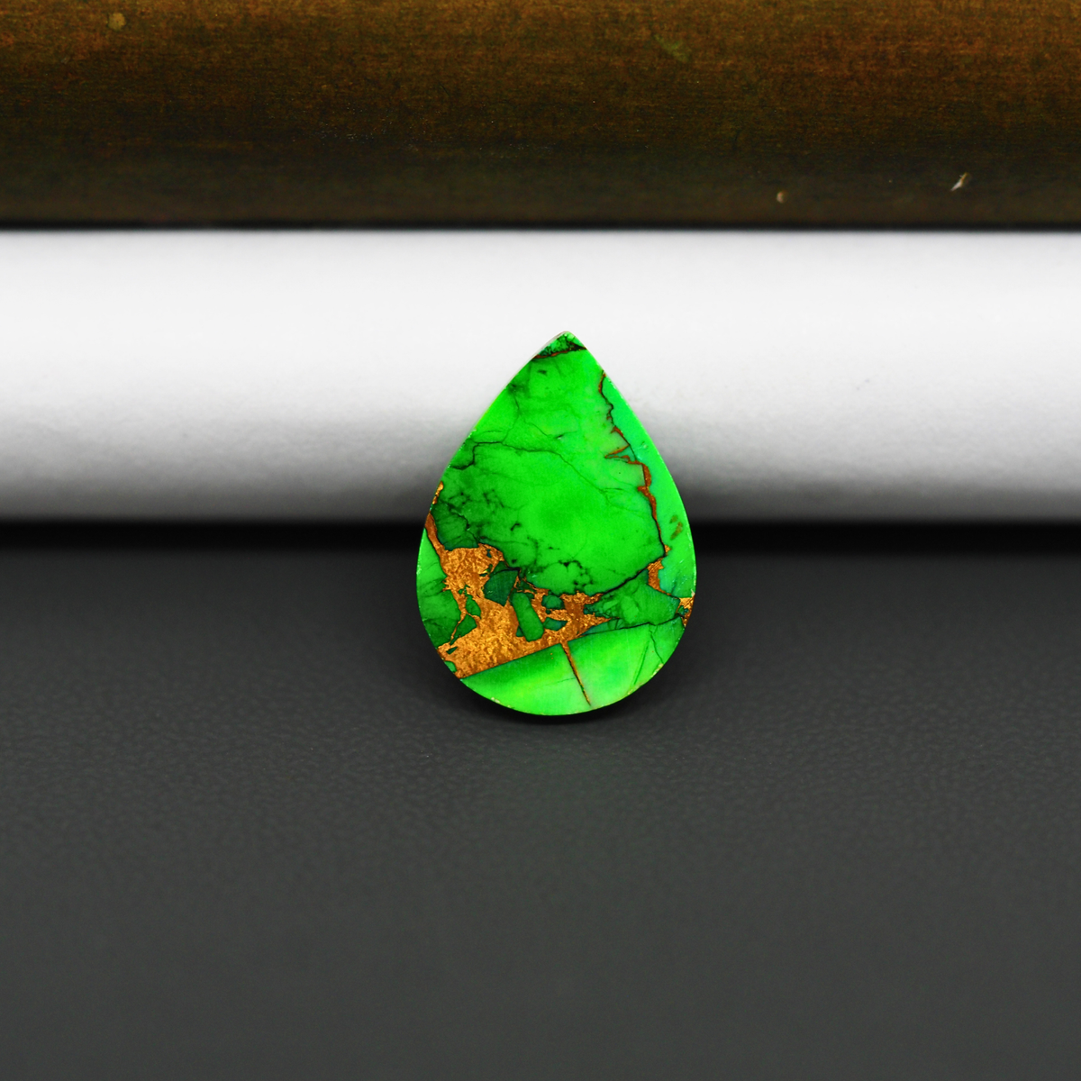Natural Emerald Dahlia Pear Cabochon 19x14mm 8.5ct - vivid green with copper matrix, ships to Europe, Japan, Canada, Australia, NZ & worldwide - Pedra Gems.