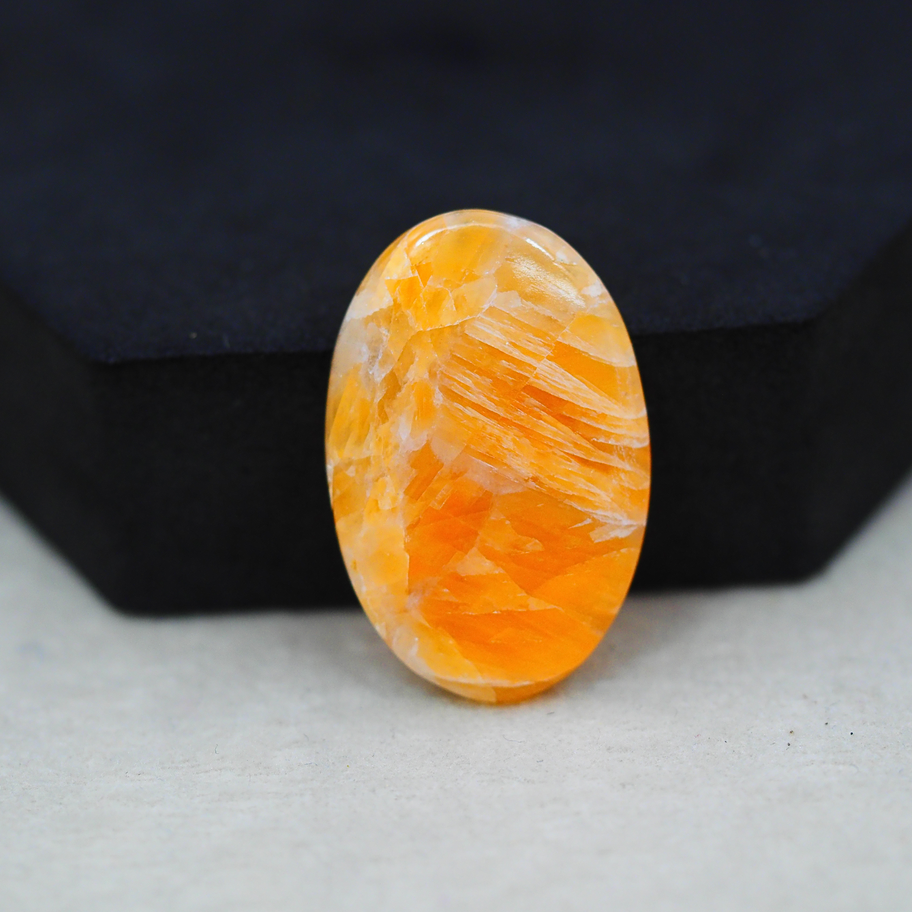 Natural Orange Calcite Oval Cabochon 31x20mm 23ct - warm honey-orange - Pedra Gems.