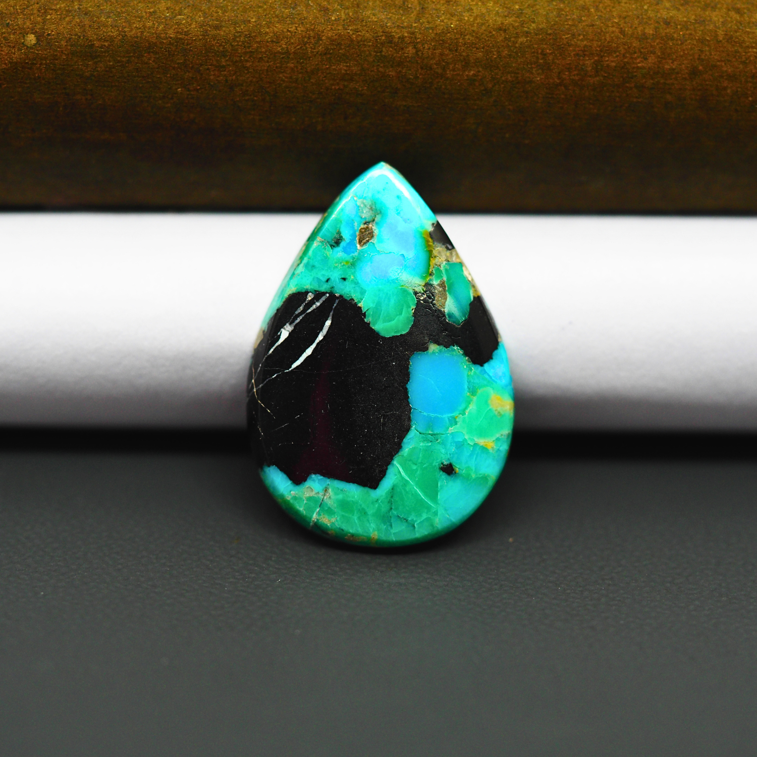 Mohave Turquoise & White Buffalo Pear Cabochon 26x18mm 11ct - Black Panel with Blue and Green - Pedra Gems