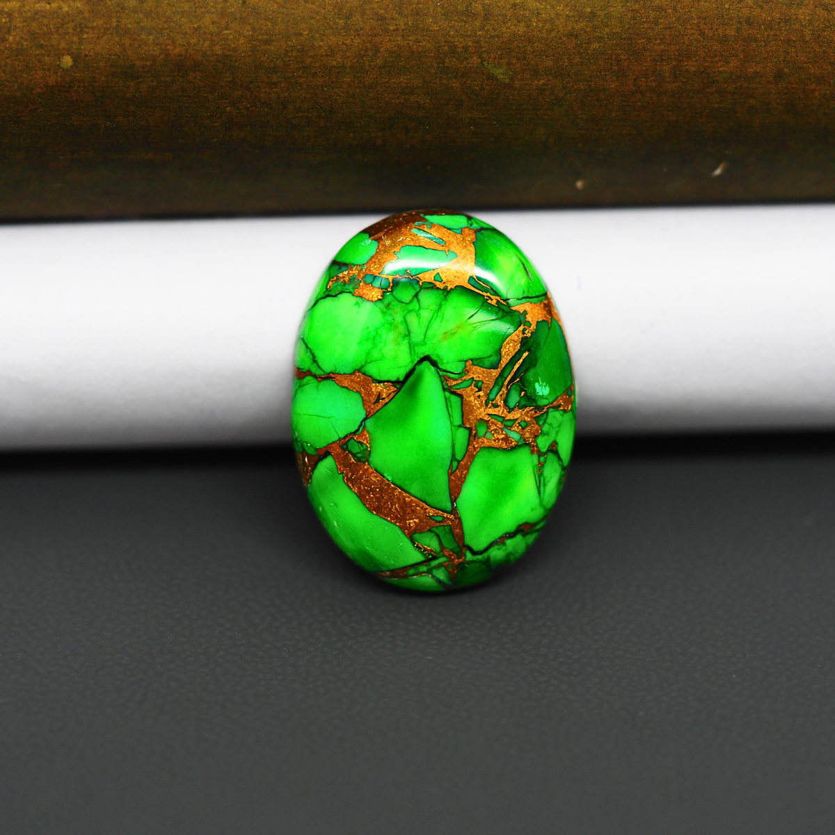 Natural Emerald Dahlia Oval Cabochon 25x18mm 18ct - vivid green with copper matrix, ships to Europe, Japan, Canada, Australia, NZ & worldwide - Pedra Gems.