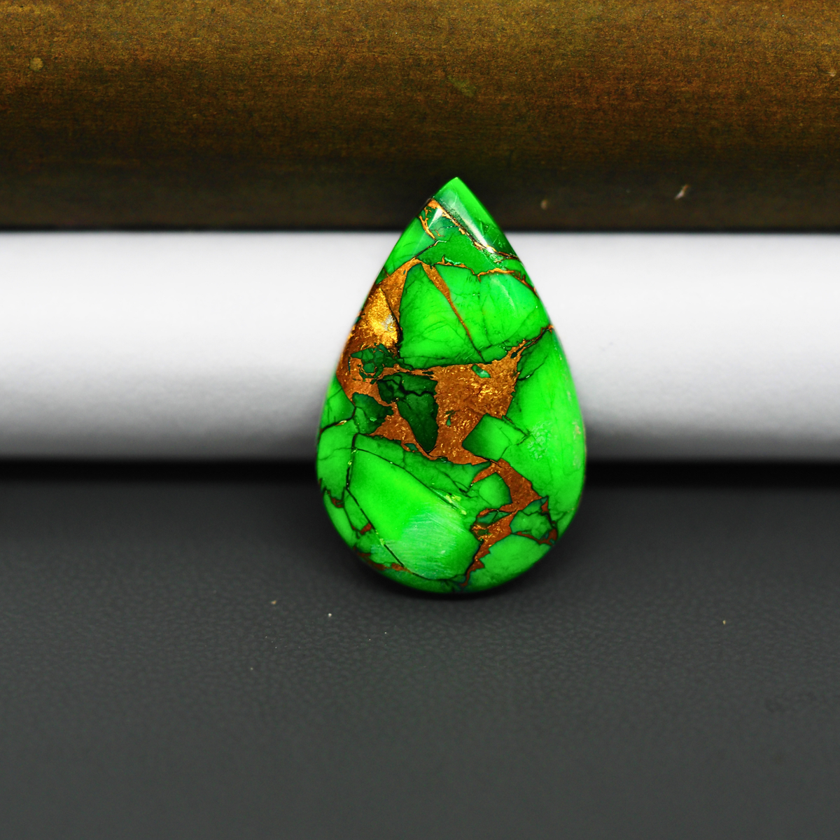 Natural Emerald Dahlia Pear Cabochon 26x17mm 15ct - vivid green with copper matrix, ships to Europe, Japan, Canada, Australia, NZ & worldwide - Pedra Gems.