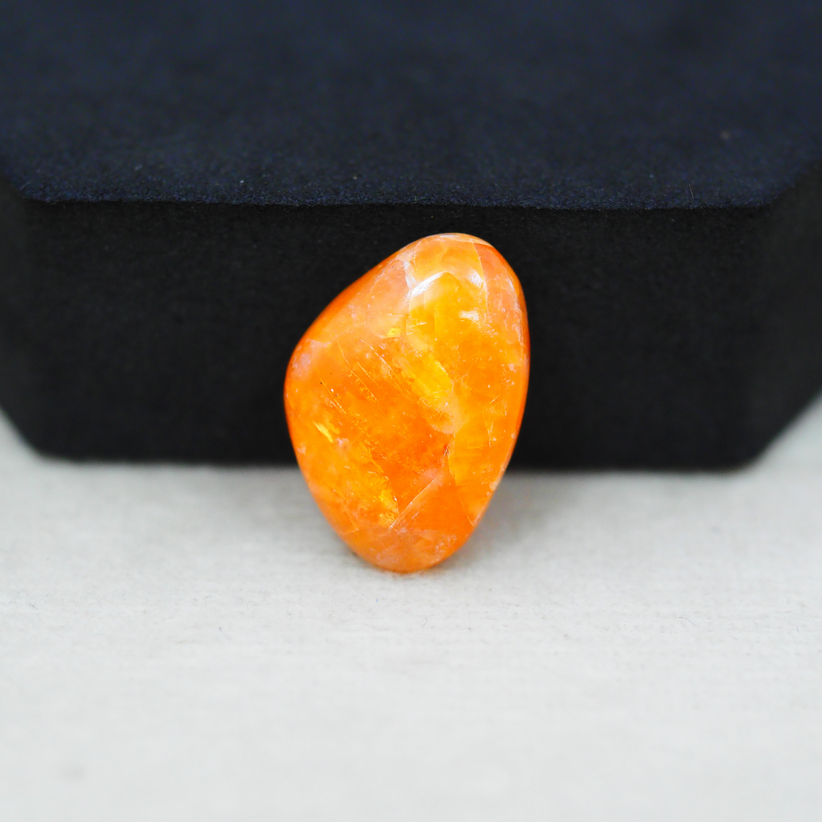 Natural Orange Calcite Trillion Cabochon 21x15mm 11.5ct - warm honey-orange - Pedra Gems.