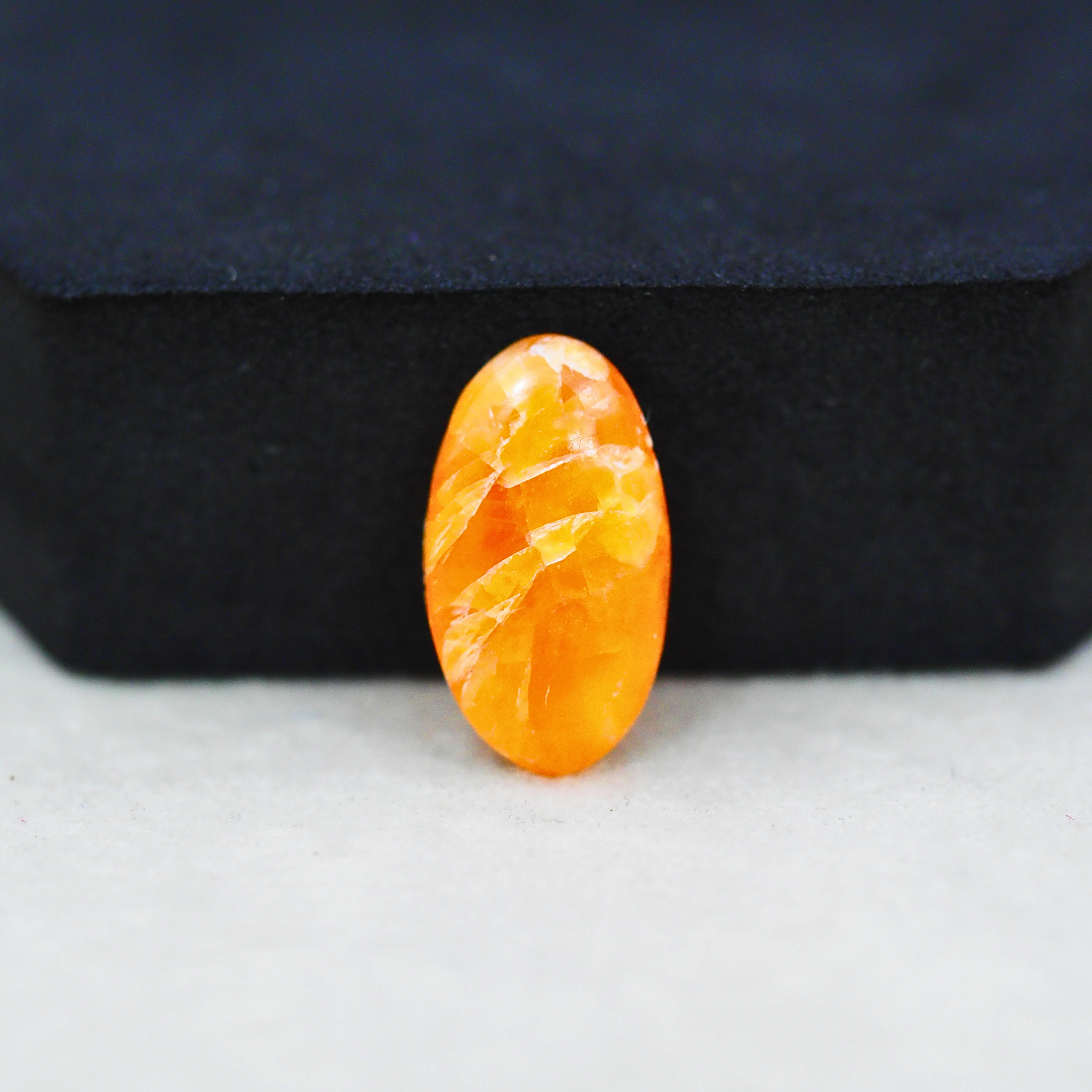 Natural Orange Calcite Oval Cabochon 19x11mm 6.5ct - warm honey-orange - Pedra Gems.